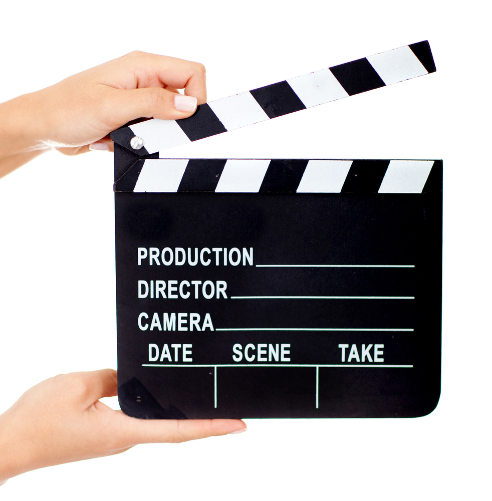 Movie clapperboard - isolated over a white background Movie clapperboard - isolated over a white background